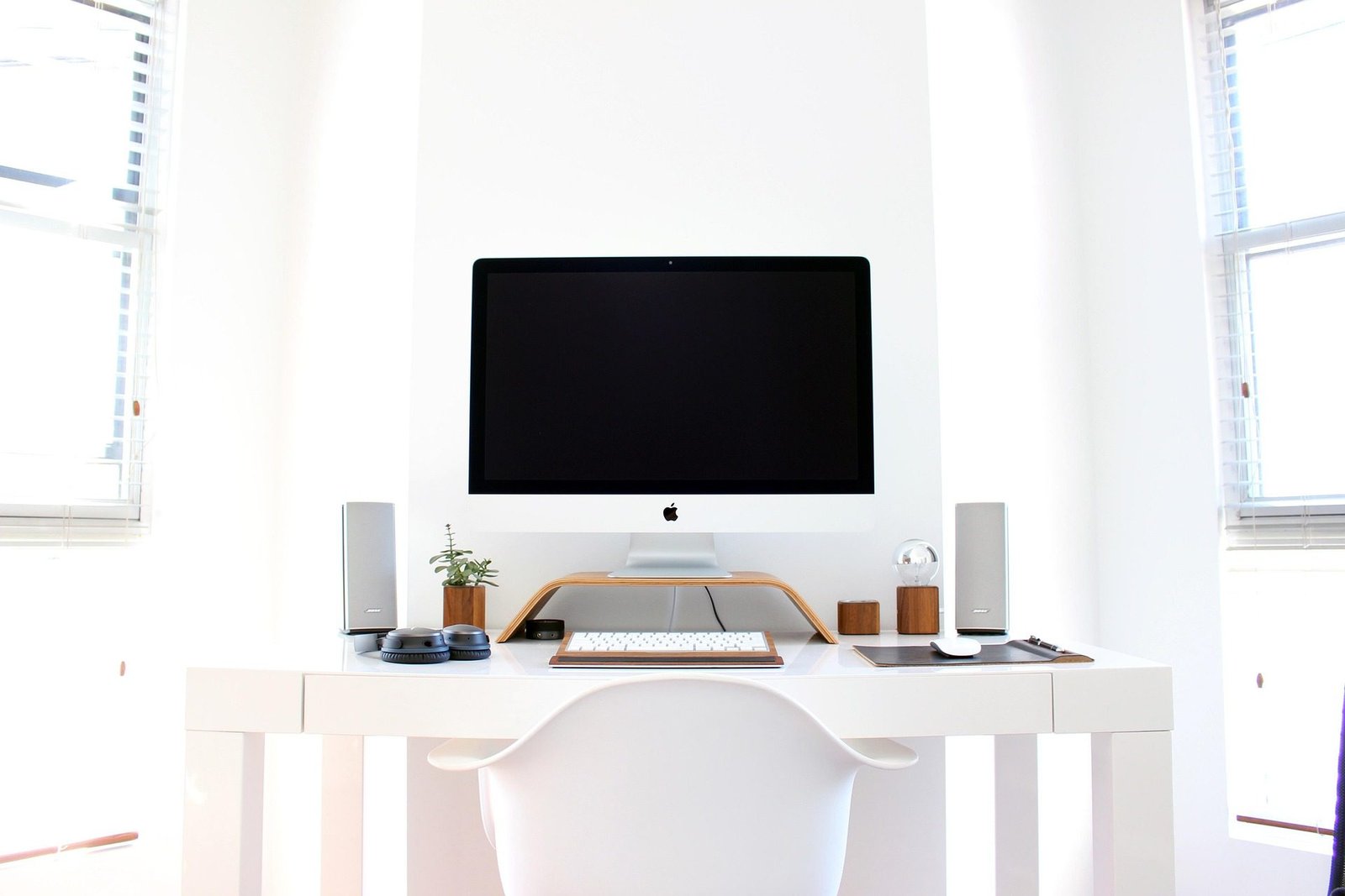 Modern white desk with three drawers and cable port for a tidy UK home office