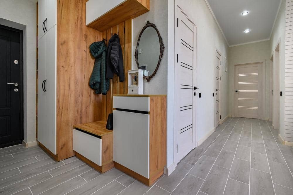 Stylish small hallway wardrobe optimised for narrow spaces with sliding doors and modern handles