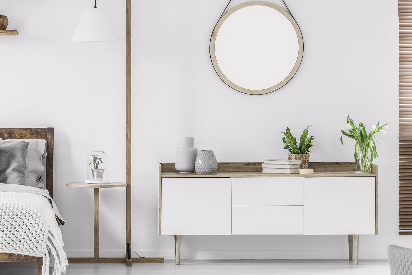 Space-efficient tallboy drawers with vertical storage in small UK bedroom interior design