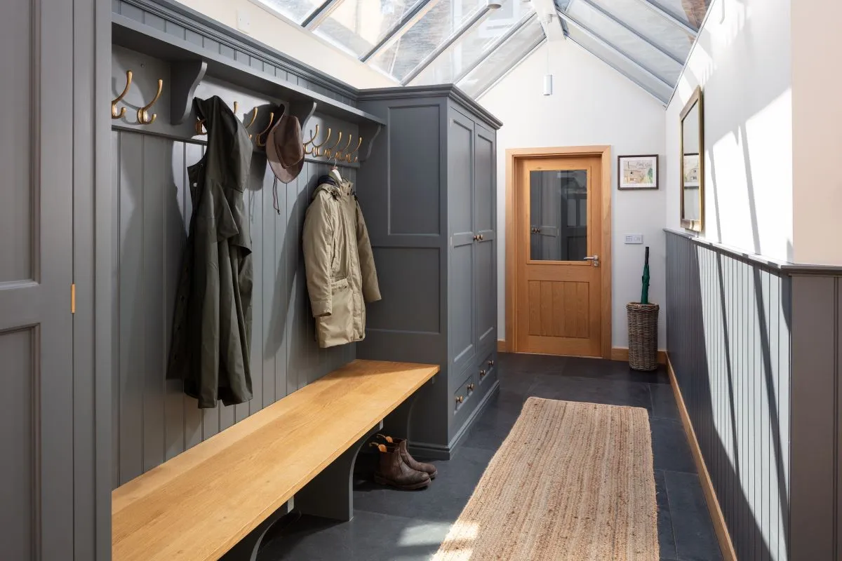 Stylish hallway wardrobe with bench featuring coat storage above and shoe shelving below seating area